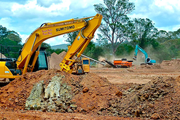 Industrial tractor digging up some land
