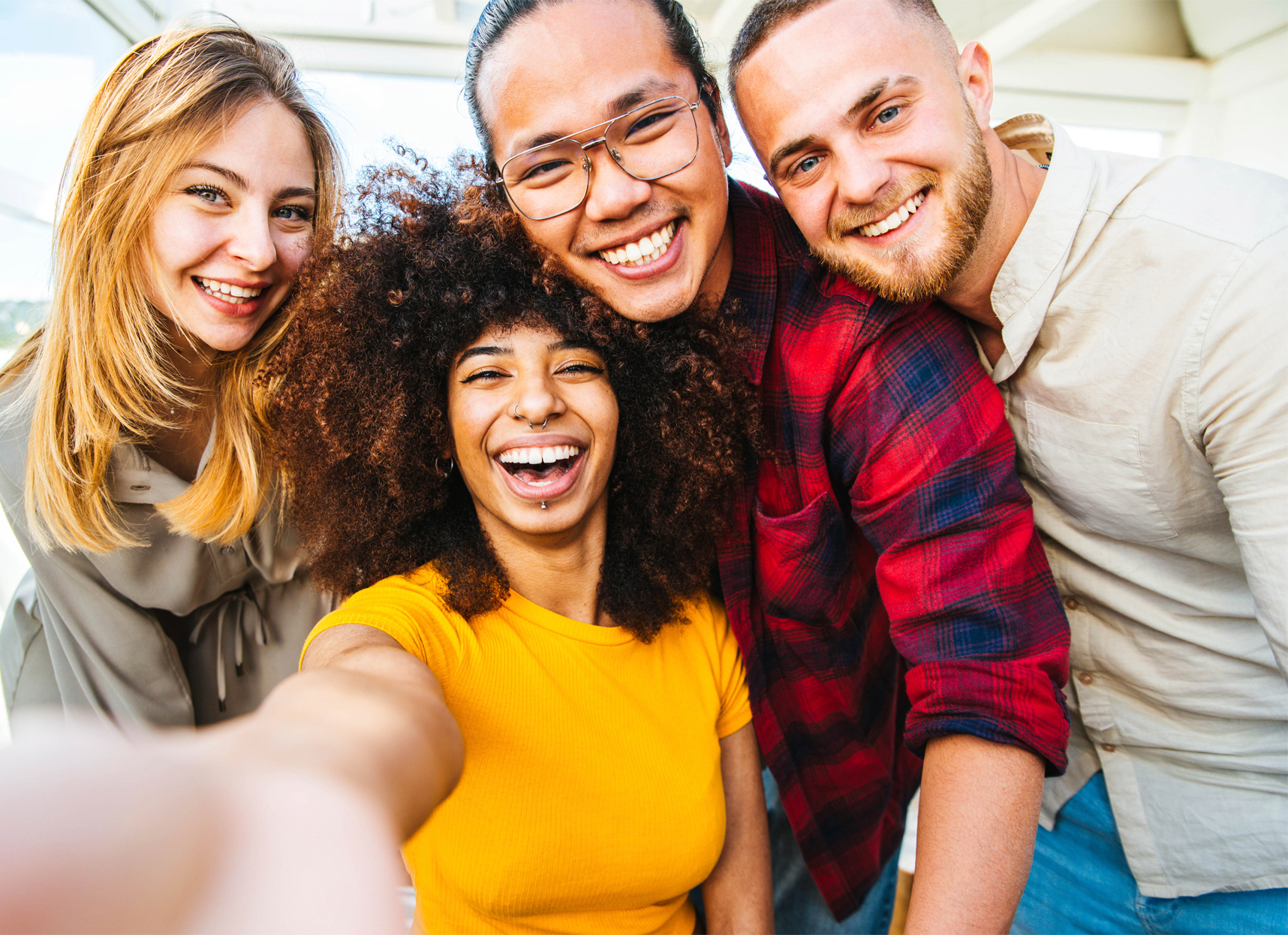 group of diverse young people smiling for a selfie