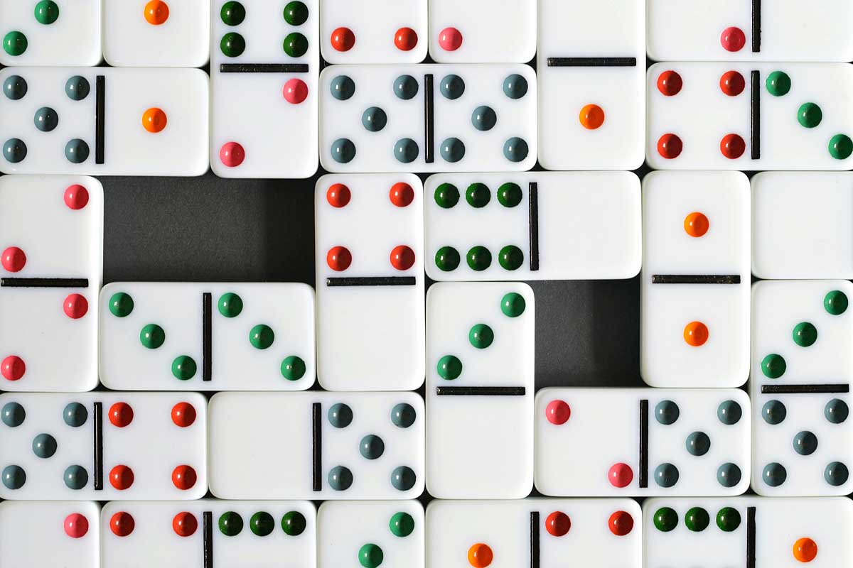 dominoes lined up, view from above - Photo by Miguel Á. Padriñán